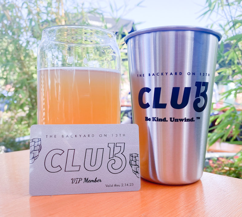 club 13 membership card, tumbler and beer at the backyard in downtown paso robles