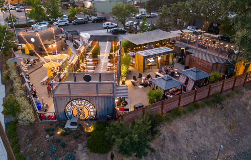a beer garden lit up with patio lights in downtown paso robles