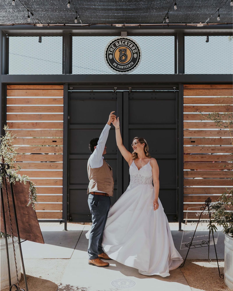 first_dance_wedding bride and groom dancing at the backyard on thirteenth wine and beer garden and event space